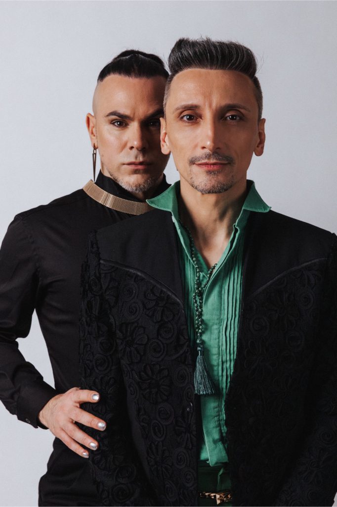 Martin Maldonado and Maurizio Ghella in black and green, close portrait on a pale ground.