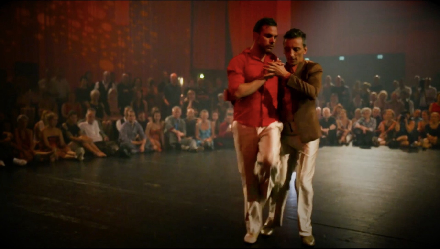 Martin Maldonado and Maurizio Ghella performing on stage before an audience